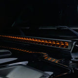 Amber Vivid Lumen light bar on a 4x4 truck, enhancing visibility in dusty off-road conditions